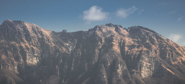 Low angle view of mountain range against sky