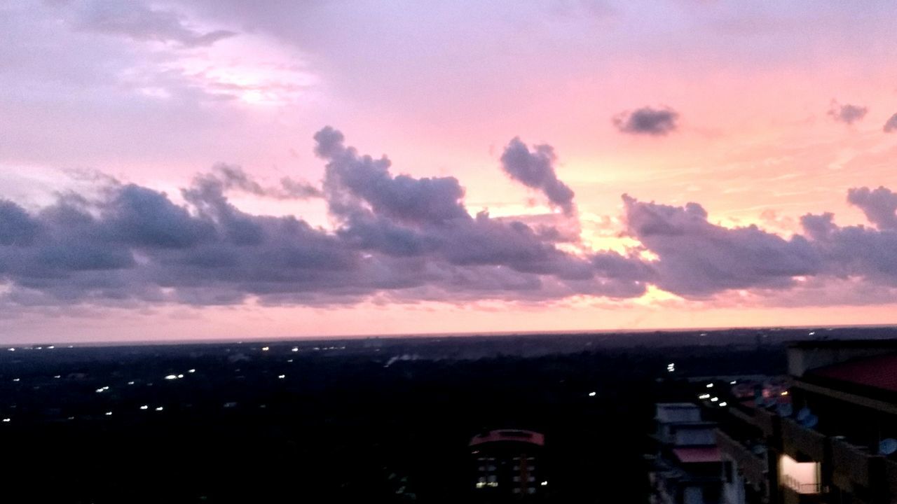 sunset, sky, cloud - sky, building exterior, architecture, built structure, city, cityscape, sea, orange color, scenics, horizon over water, beauty in nature, cloud, cloudy, nature, silhouette, high angle view, water, dusk