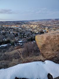 Aerial view of townscape against sky during winter