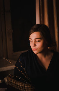 Close-up of young woman looking down