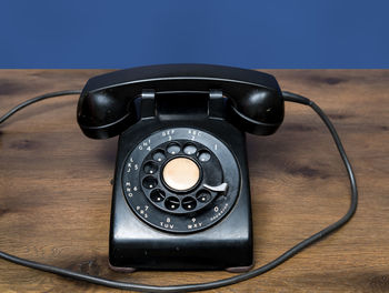 Close-up of telephone on table