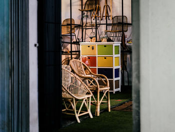 Rattan furniture on display on a high street shop front