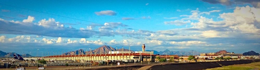 View of railroad station platform against cloudy sky