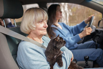 A family driving by car together with their pet. rules of border crossing with animals. travel