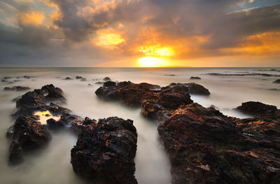 Scenic view of sea against sky during sunset