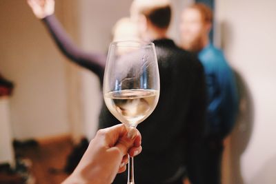 Midsection of woman drinking glass