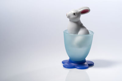 Toy rabbit in a plastic egg cup