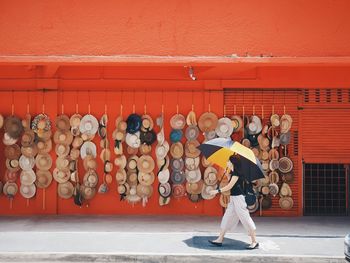 Woman standing against graffiti wall