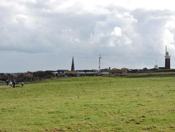 View of landscape against cloudy sky