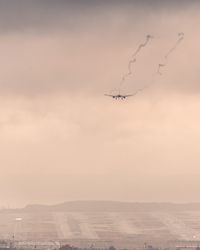 Airplane flying in sky