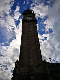Low angle view of clock tower against sky
