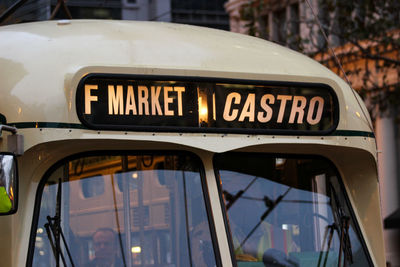 Close-up of information sign in city