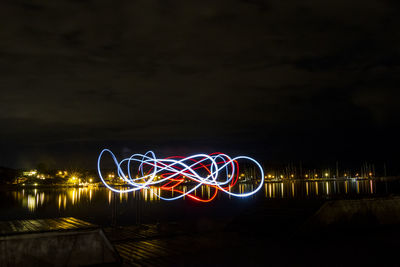 Light trails against sky at night