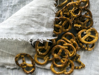 High angle view of wheat pretzels on linen fabric