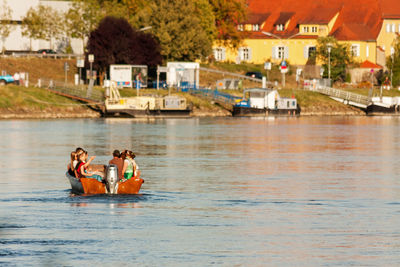 People sitting on boat in water