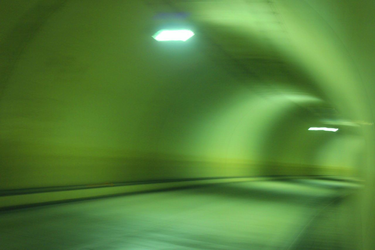 illuminated, indoors, lighting equipment, wall - building feature, light - natural phenomenon, night, ceiling, empty, green color, built structure, no people, electric light, wall, architecture, electricity, absence, light, the way forward, diminishing perspective, tunnel