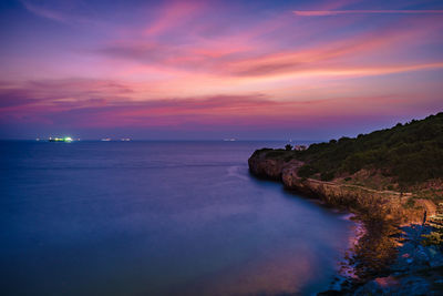 Scenic view of sea against sky at sunset