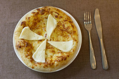 Directly above shot of pizza in plate