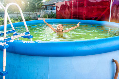 Girl swimming in wading pool