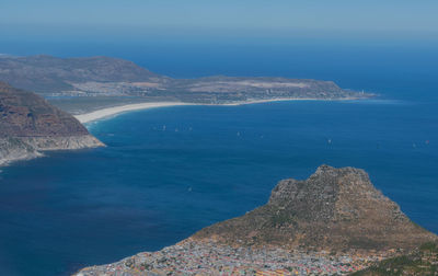 High angle view of townscape by sea against sky