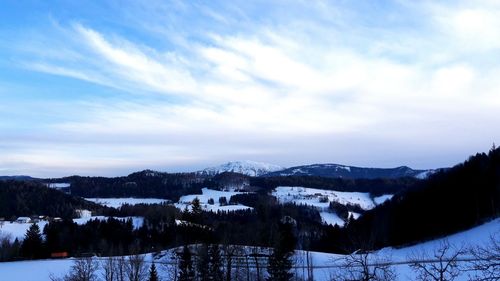 Scenic view of mountains against sky during winter