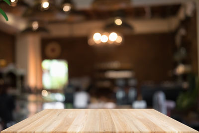 Close-up of illuminated lights on table in restaurant