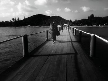 Pier on sea against sky