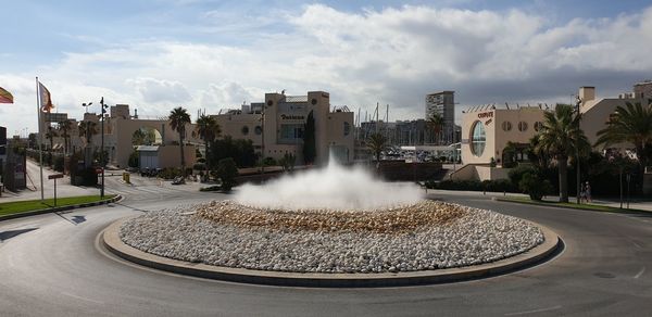 Panoramic view of city buildings against sky