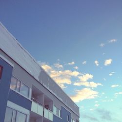 Low angle view of building against blue sky