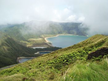 Scenic view of mountains against cloudy sky