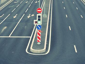 High angle view of road signs on street