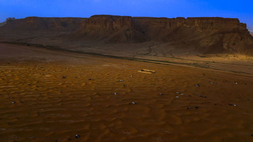 Scenic view of desert against sky