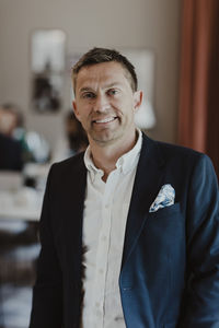 Portrait of smiling male entrepreneur at corporate office