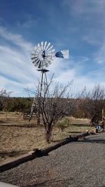 Traditional windmill in field