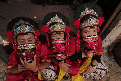 Low angle view of dancers wearing mask