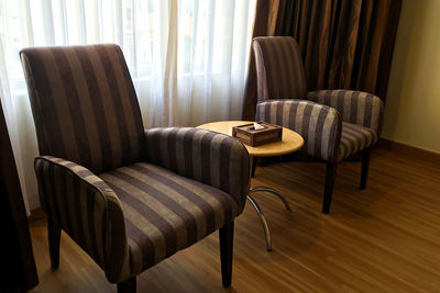 Empty chairs and table at home