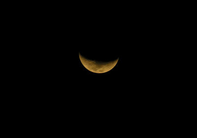 Low angle view of moon against sky at night