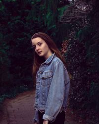 Portrait of young woman in forest