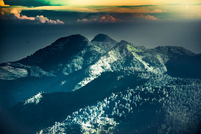 Aerial view of sea and mountain against sky