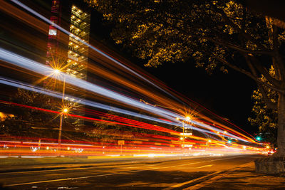 High angle view of light trails on road at night