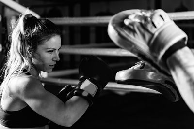 Woman on boxing training with personal trainer