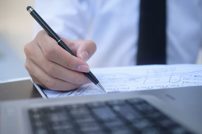 Close-up of hand writing