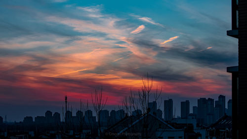 Cityscape against sky during sunset