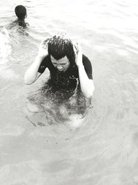 Close-up of man swimming in sea