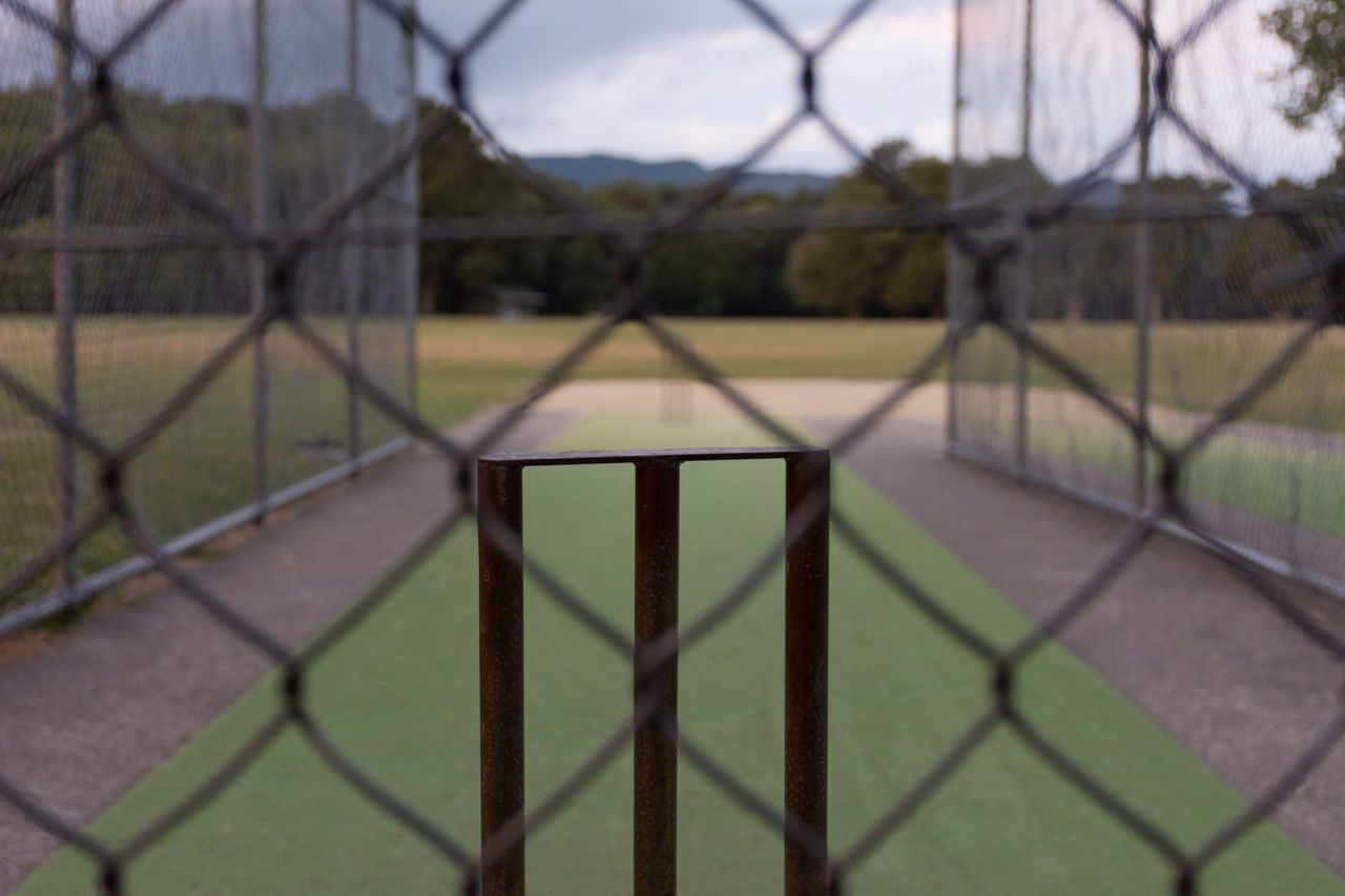 VIEW OF SOCCER FIELD SEEN THROUGH FENCE