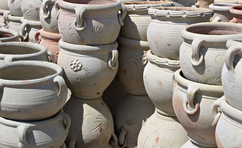 Close-up of terracotta pots during sunny day