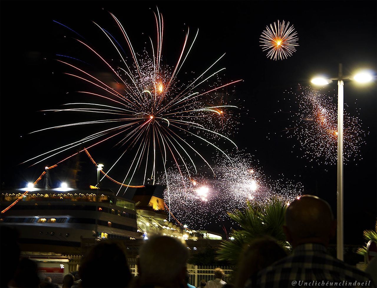 LOW ANGLE VIEW OF FIREWORK DISPLAY