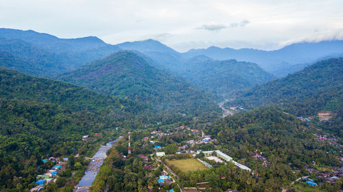 High angle view of townscape against mountains