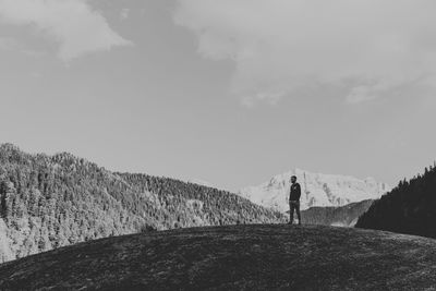 Man on mountain against sky