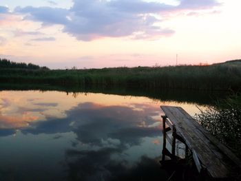 Scenic view of lake against sky during sunset